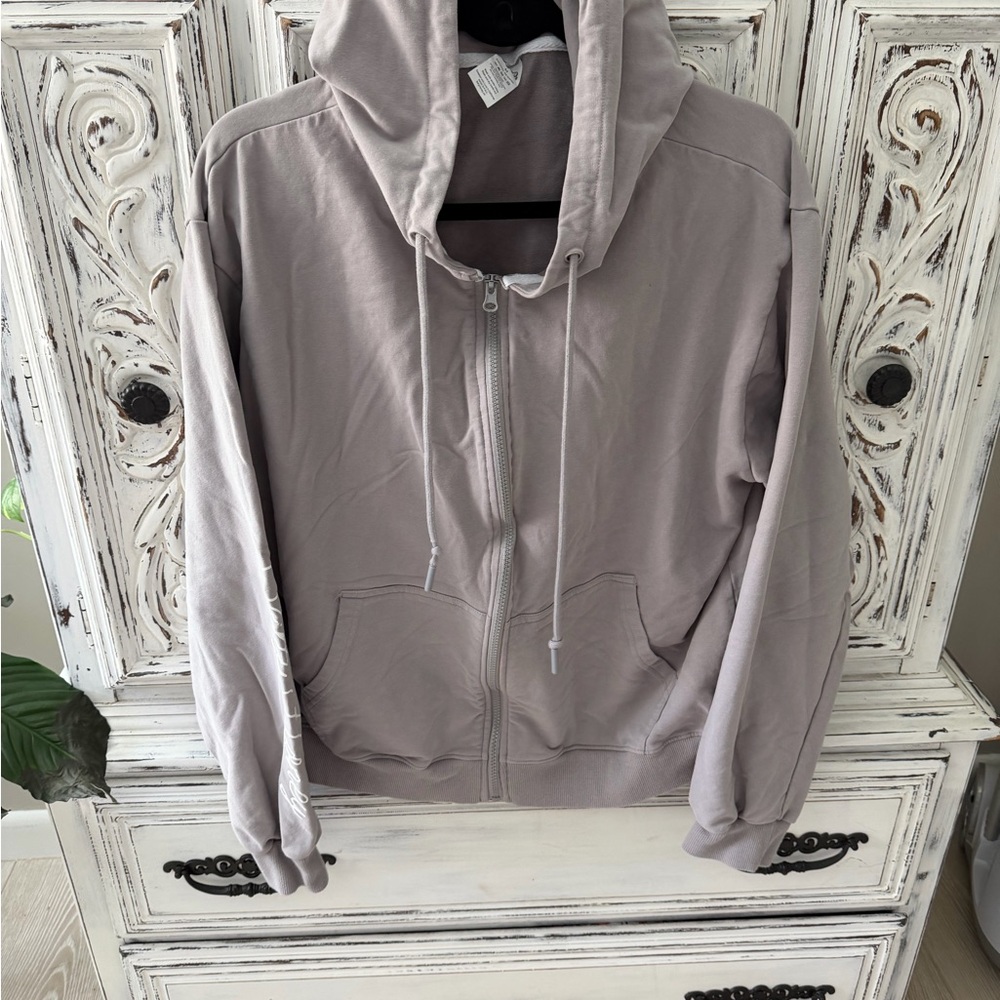 Women's Light Grey Zip-Up Hoodie with lightning bolt on back